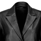 Close-up of black leather texture on a women’s blazer