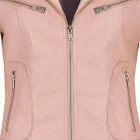 Stylish woman posing in a vibrant pink biker leather jacket