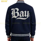 Model wearing Bay FC Letterman Jacket front view, streetwear outfit with wool body and leather sleeves