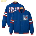 Blue full-snap varsity jacket paired with a white shirt and denim jeans, creating a modern sporty streetwear look for casual everyday wear.