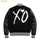 Side profile of The Weeknd XO Leather Varsity Jacket highlighting ribbed cuffs and XO logo