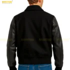 Back view of 90’s Ruffhouse Records bomber jacket showing embroidered logo and ribbed waistband